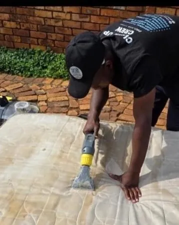 Clean Up Crew member deep cleaning a mattress in Middelburg